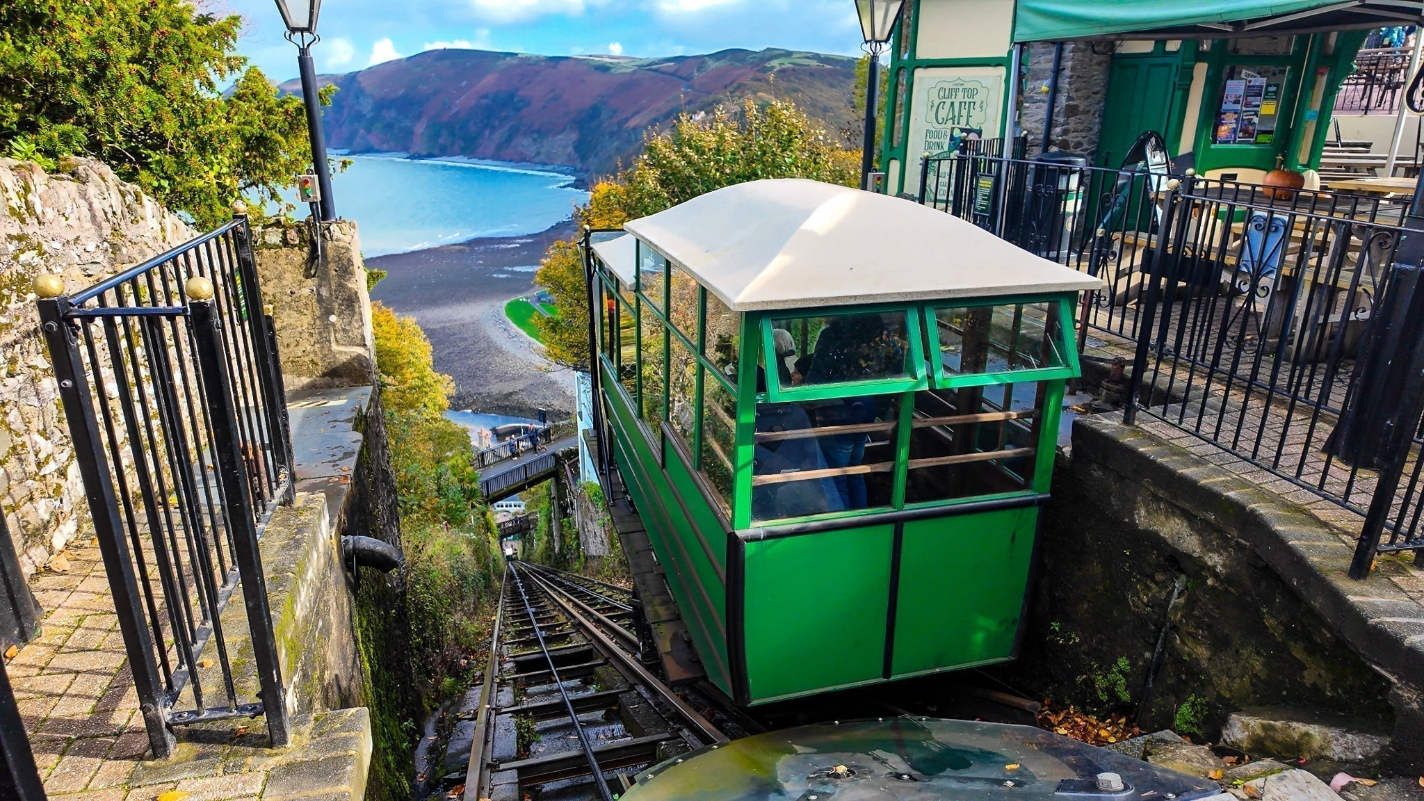 Lynton and Lynmouth Cliff Railway car at the top station, looking down the cliff face towards Lynmouth bay, north Devon